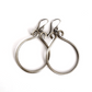 A set of sterling silver hoop earrings on  a white background. The hoops have been oxidised.